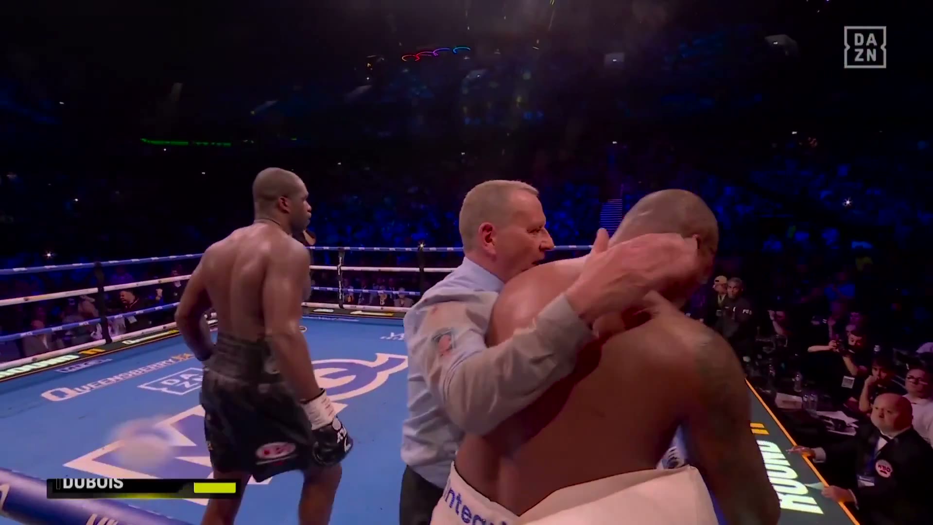 Daniel Dubois walks away as the referee holds Fabio Wardley after their first fight in May 2026 — Saturday's rematch at The O2 ended even faster, in two rounds